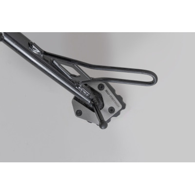 Nástavec pro nohu bočního stojanuTento nástavec patky byl vyvinut speciálně pro boční stojan modelu Moto Guzzi V85 TT.Tento odol